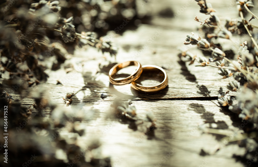 wedding rings on a bouquet of flowers wedding rings on a bouquet of flowers