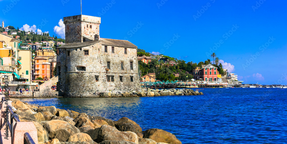 Beautiful italian coastal town Rapallo. View of medieval fortress and beach. Italy, Liguria summer holidays
