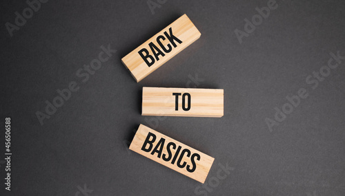 back to basics word written on wood block. objective text on table, concept. photo