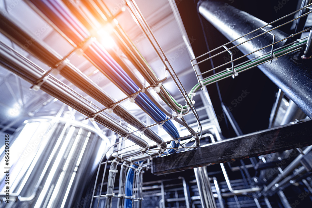 Fototapeta premium Pipes and fittings at a craft modern brewery