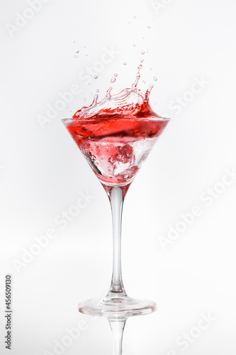 cocktail glass with moving red liquid