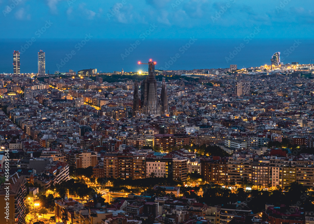 Barcelona aerial city view with Sagrada Familia at dusk from Guinardo bunkers