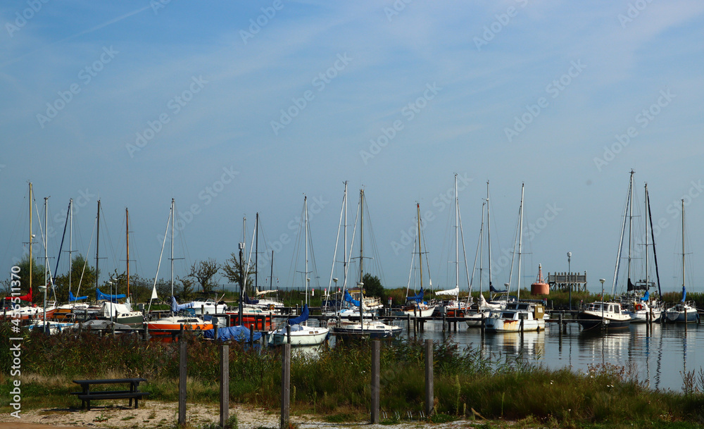 Dutch landscape. Boats on water. Blue sky, sunny day photo. North Holland landscapes. 