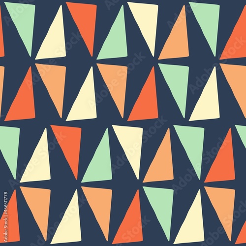 Abstract seamless pattern with isolated colorful triangles on the dark blue background. Vector background of geometry shapes for wrapping, wallpaper, interior decor, packaging, textile and other
