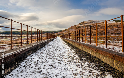 A snow covered old railway viaduct at the Big Water of Fleet at the Cairnsmore photo