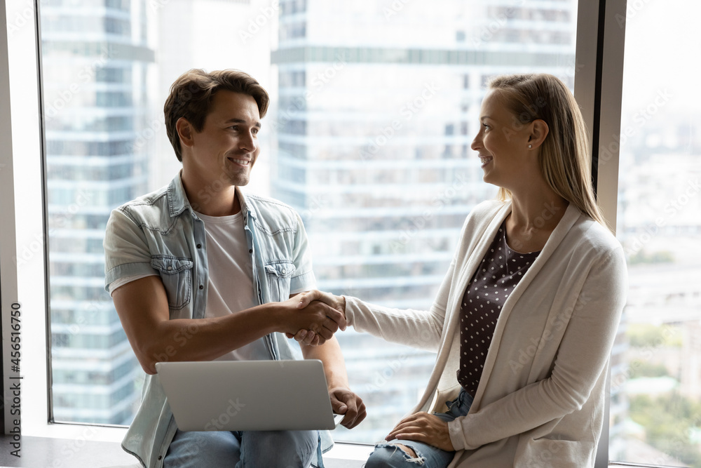 Happy diverse Caucasian businesspeople shake hands close business deal or make agreement at negotiations. Smiling employees or partners handshake get acquainted greeting in office. Happy diverse Caucasian businesspeople shake hands close business deal or make agreement at negotiations. Smiling employees or partners handshake get acquainted greeting in office.