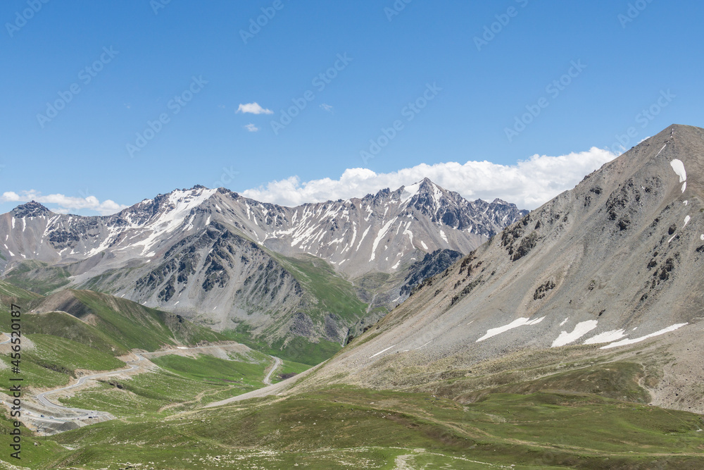 Mountains and grasslands along G217 highway in Xinjiang, China in summer