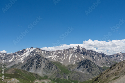 Mountains and grasslands along G217 highway in Xinjiang, China in summer