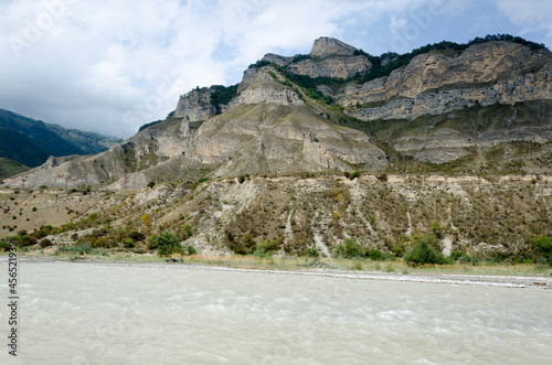 stormy mountain river against the background of the mountain