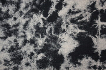 black and white Tie dye green background with layers of dye pattern black white dye fabric textile