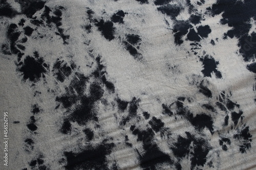 black and white Tie dye green background with layers of dye pattern fading from green to white dye fabric textile