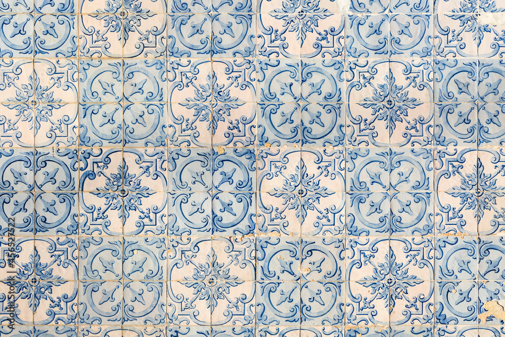 old Portuguese tiles with a pattern of painted flowers