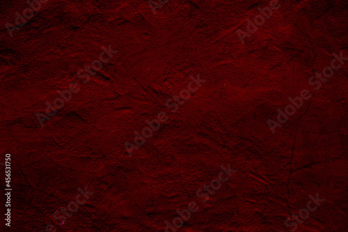 Crimson colored wall background with textures of different shades of crimson red