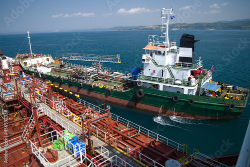 Slop barge approaching small tanker