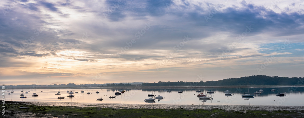 boats in river la rance in french region of brittany at sunrise in summer boats in river la rance in french region of brittany at sunrise in summer