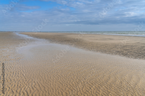 Endless white sand beach on Fanø island, North Sea, Denamrk. The entire windy western coast of the island is a long beach with perfect condition for a variety of sports
