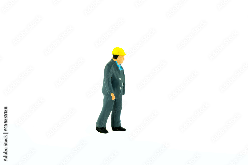 Miniature people engineer worker construction concept on white background Miniature people engineer worker construction concept on white background