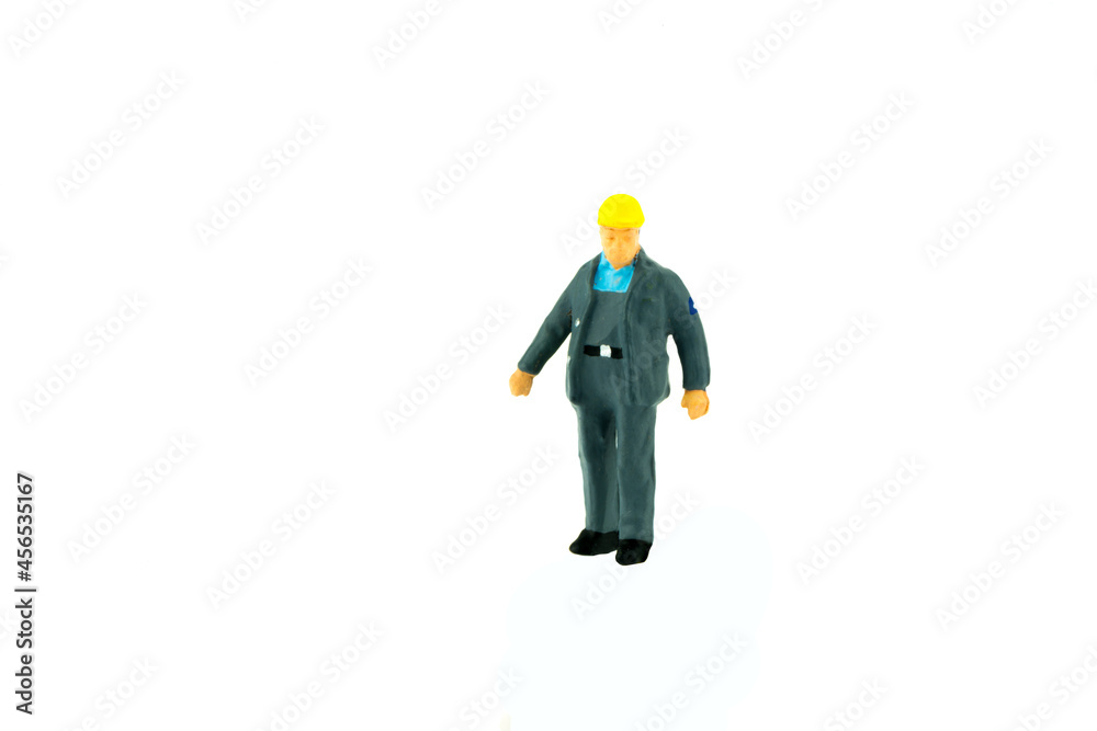 Miniature people engineer worker construction concept on white background Miniature people engineer worker construction concept on white background