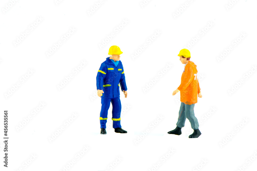 Miniature people engineer worker construction concept on white background Miniature people engineer worker construction concept on white background