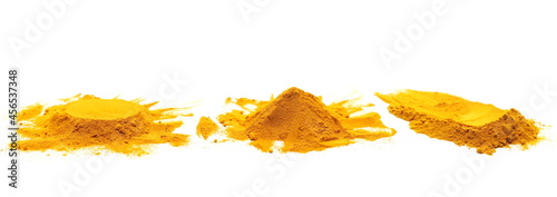 Set turmeric powder pile isolated on white background, side view