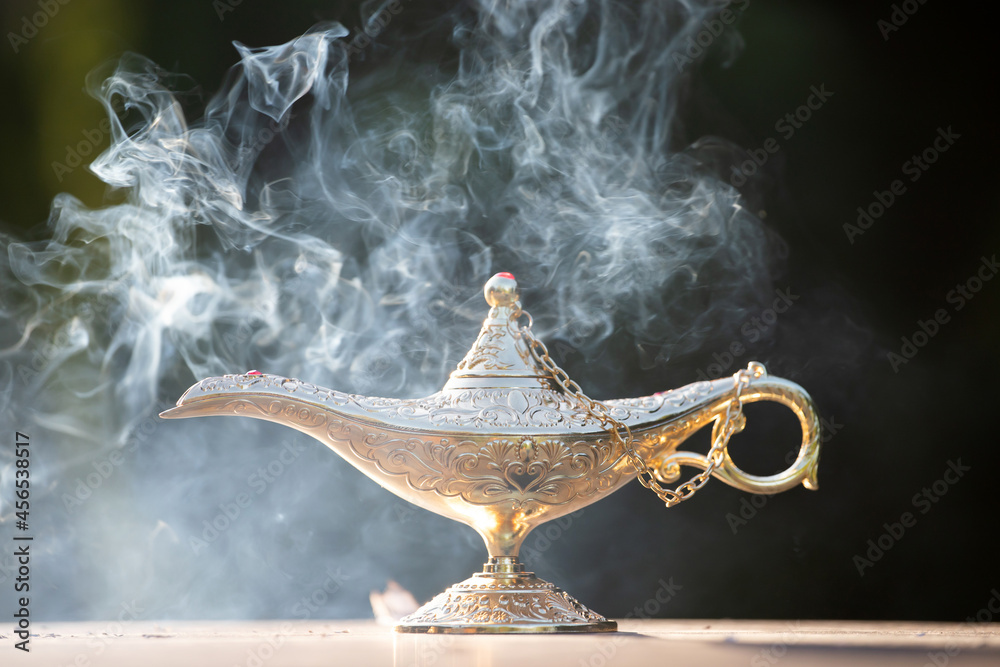 Aladdin lamp of wishes in magic smoke Stock Photo | Adobe Stock