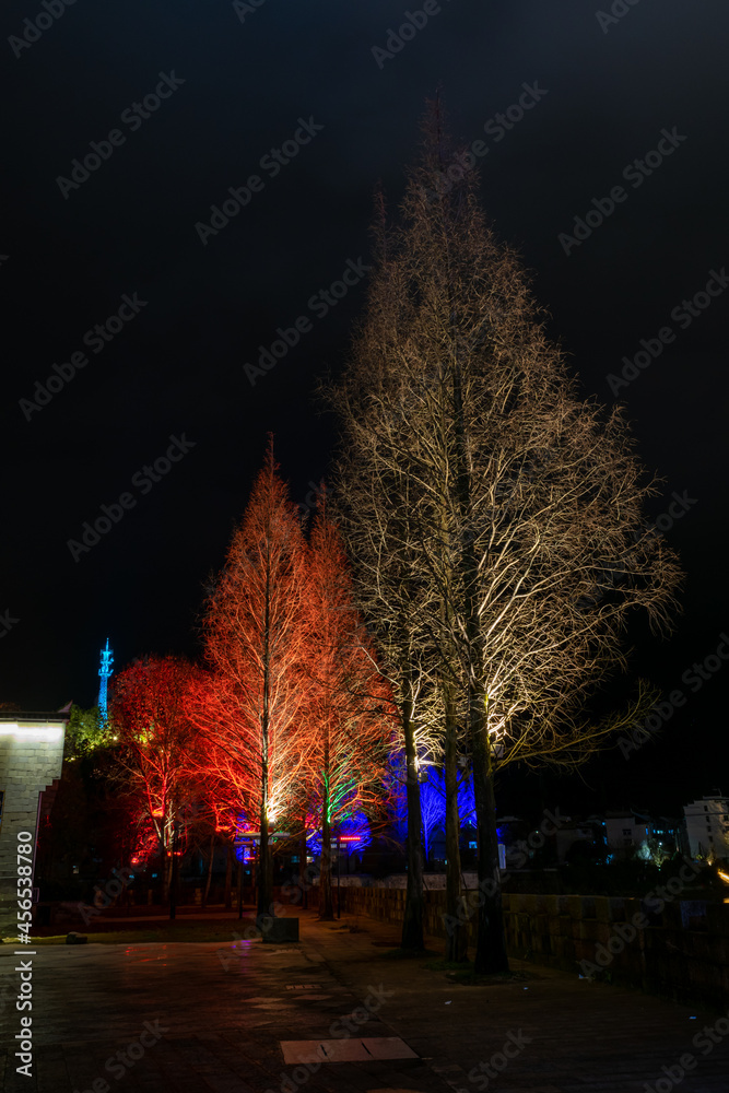 At night, the trees are decorated with lights to look like festivals