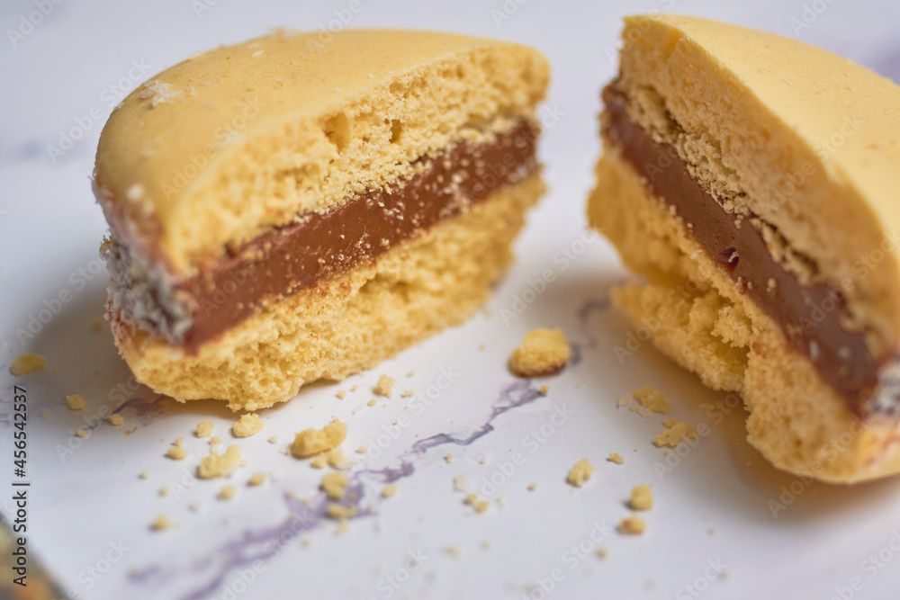 Traditional Argentinian alfajores with dulce de leche on marble table. Argentine gastronomy concept.