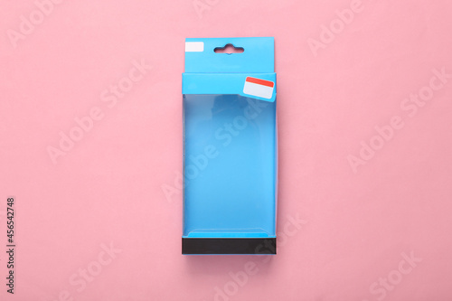 Photography Blank packaging box with transparent front on pink background