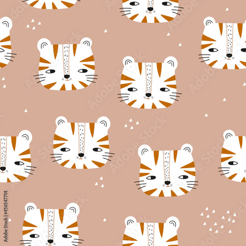 Seamless childish pattern with cute tiger heads. Modern cartoon baby tigers texture for fabric, textile, wallpaper. Vector illustration