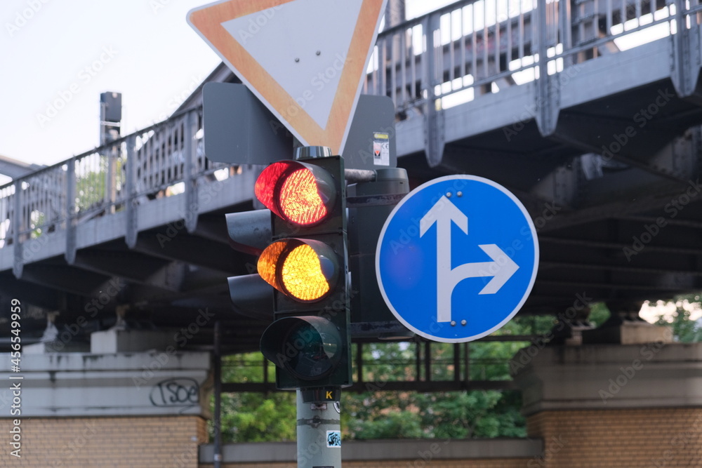 Red and yellow traffic light and road signs Stock Photo | Adobe Stock