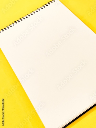 sheet of plain paper on a yellow background