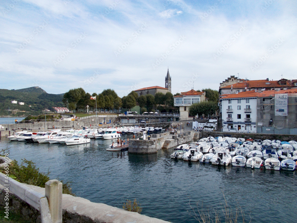 River next to the port with boats in the municipality of Mundaca-Mundaka, in the Basque Country, north of Spain. Located next to the Cantabrian Sea. Europe. Horizontal photography.