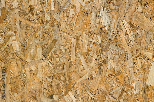 The oriented strand board background light brown color panel pressed sawdust
