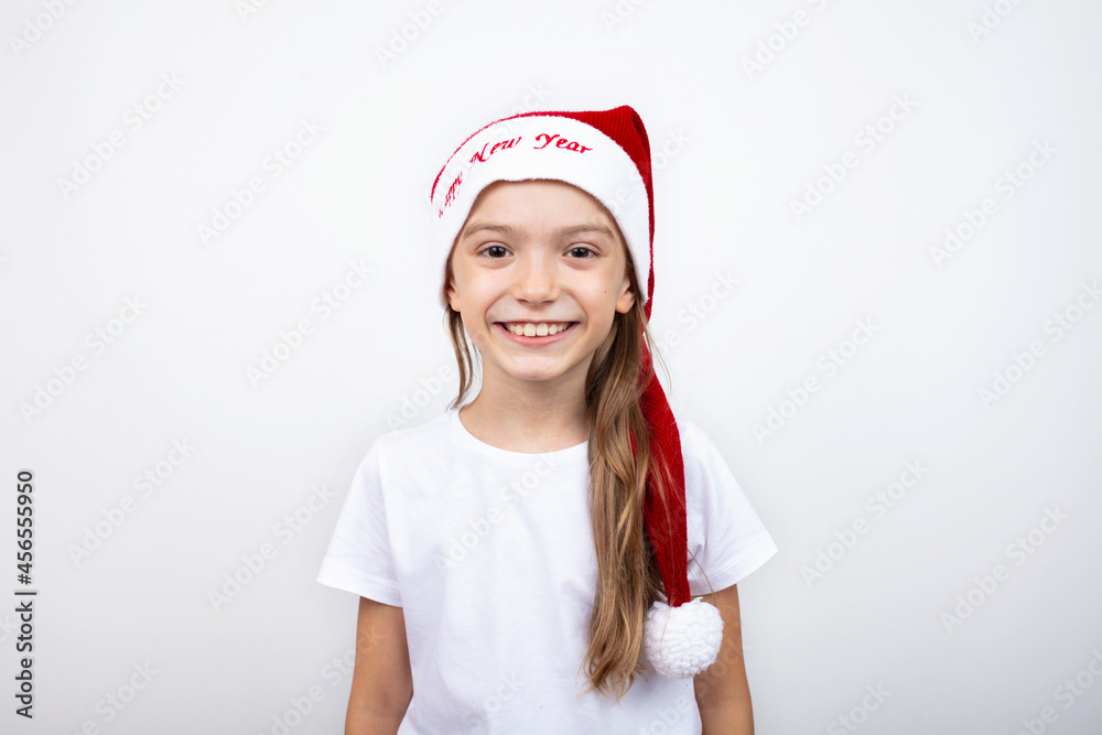 Little caucasian girl in santa hat on white background. Happy smiling kid. christmas design empty copy space.Child's portrait.
Little caucasian girl in santa hat on white background. Happy smiling kid. christmas design empty copy space.Child's portrait.