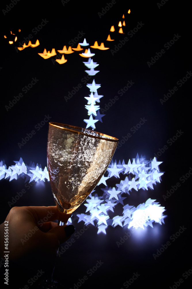 photo of two champagner glass on glass table with bokeh background