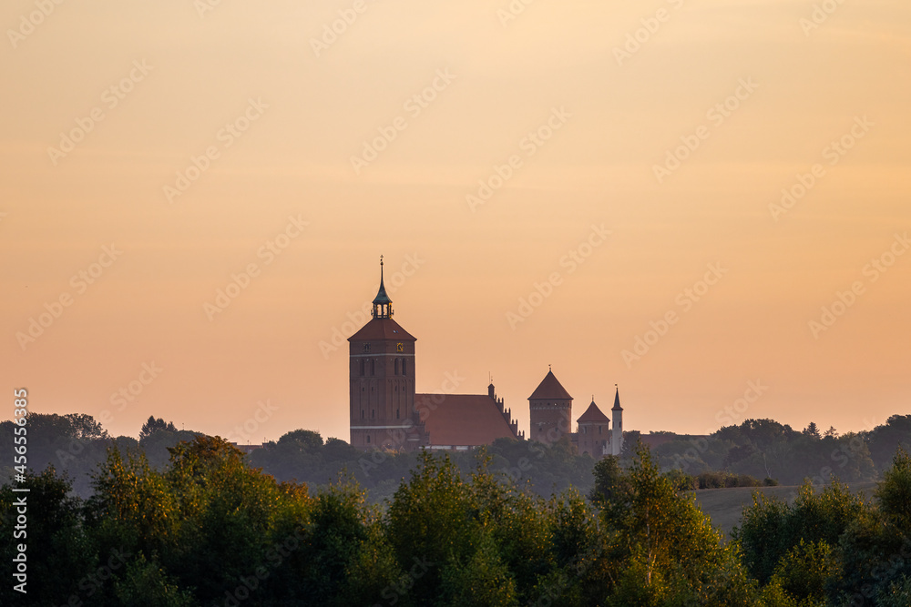 The Church of Saint Apostles Peter and Paul and the Castle in Reszel - At sunrise, Warmia and Masuria