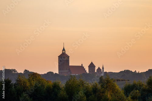 The Church of Saint Apostles Peter and Paul and the Castle in Reszel - At sunrise, Warmia and Masuria