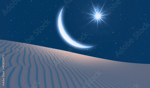 Crescent Moon with Venus at sunset sand dune of desert in the foreground