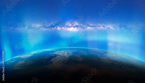 Fototapeta Naklejka Na Ścianę i Meble -  Northern lights aurora borealis over planet Earth with amazin galaxy of Milky Way 
