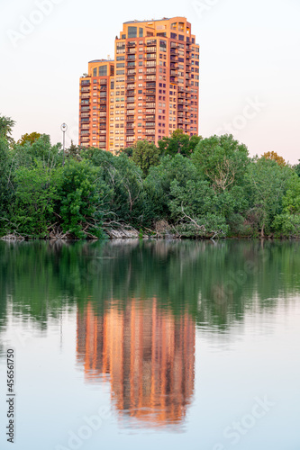 High rise apartment on the edge of a lake reflection