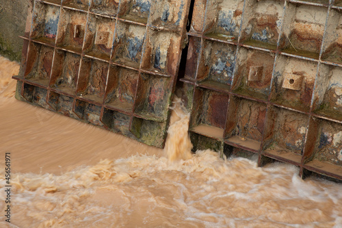 Floodgate in Ebro river, Zaragoza. Close up. Waste water. photo