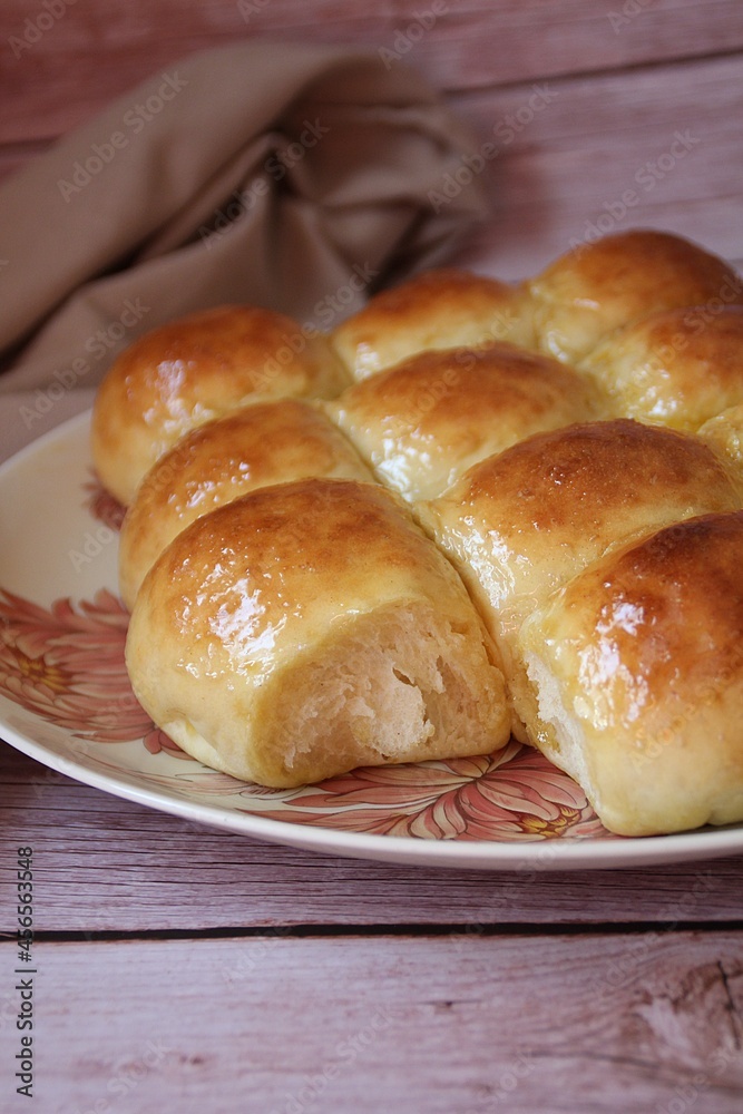 homemade yeast buns, brioche buns, glowing buns, homemade baked goods on a plate