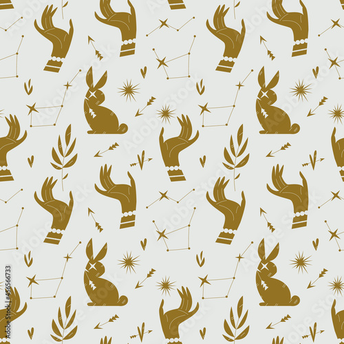 Pattern with golden hands, stars and bunnies in a minimalist style. Seamless mystical pattern on the theme of Tarot cards, mysticism and magic. Gold and white - beautiful feminine decor