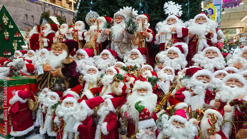 Ternopil, Ukraine - November 6, 2018: Many Santa Claus figurines stand on the shelf of the Christmas Fair at the mall
