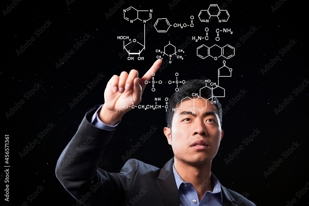 Businessman pointing at scientific diagram Businessman pointing at scientific diagram