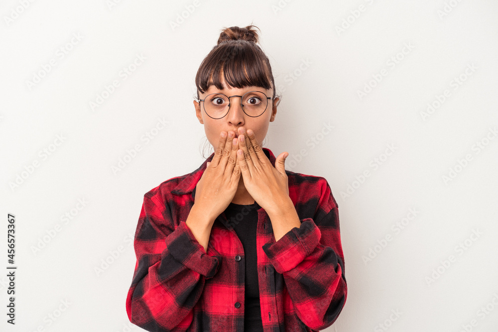 Young mixed race woman isolated on white background  shocked, covering mouth with hands, anxious to discover something new.