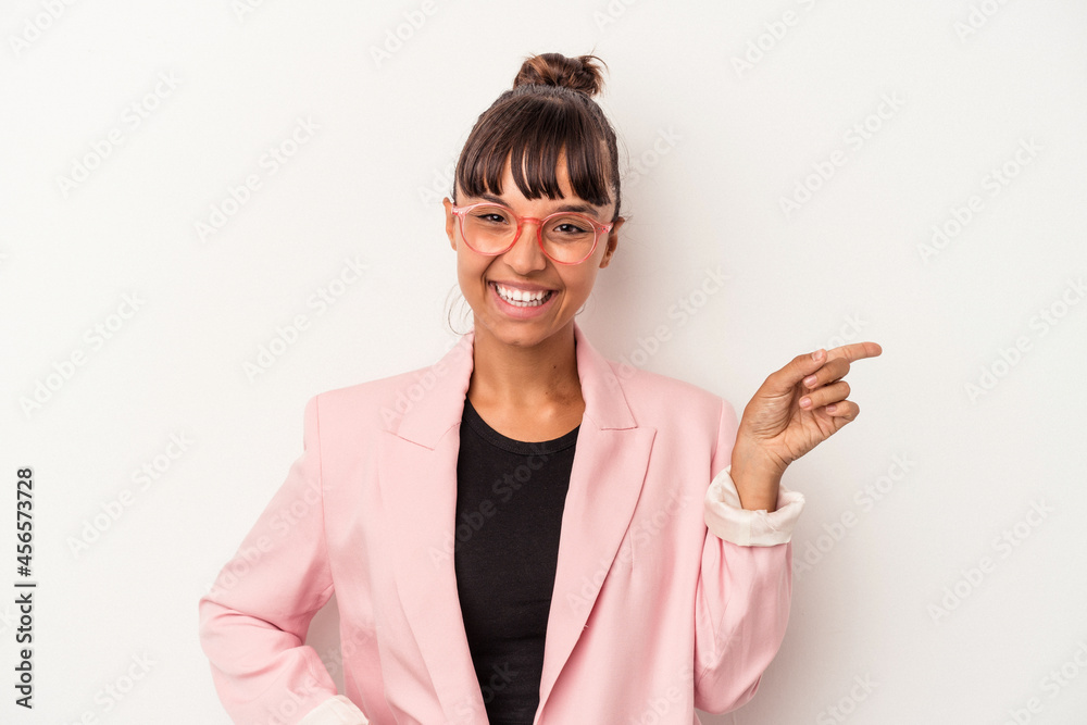 Young mixed race woman isolated on white background smiling cheerfully pointing with forefinger away. Young mixed race woman isolated on white background smiling cheerfully pointing with forefinger away.