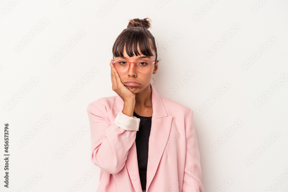 Young mixed race woman isolated on white background  who feels sad and pensive, looking at copy space.