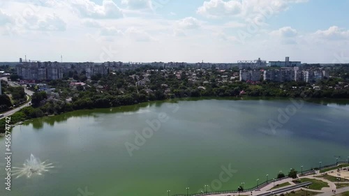 View of residential buildings and Ostashkovsky Pond in Uman. Drone Video. Ukraine. Europe	 photo