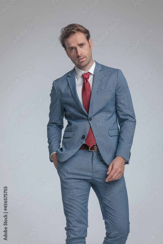 Fototapeta premium fashion model posing with one hand in pocket